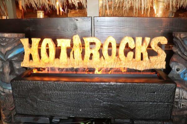 Hot rocks sign with lava rocks