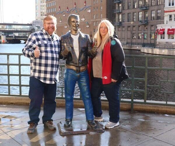 Gary and Michelle visiting the bronz Fonz in Milwaukee