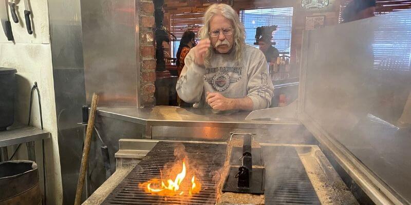 Steve "Doc" Hopkins watching the timeline burger cook