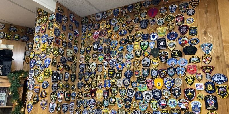 Law enforcement badges on the wall in the Texas Hall of Fame gift shop