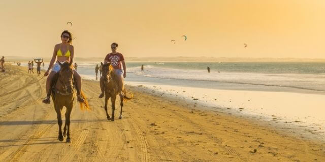 riding horses on the beach