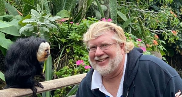 Gary and a monkey in the rainforest