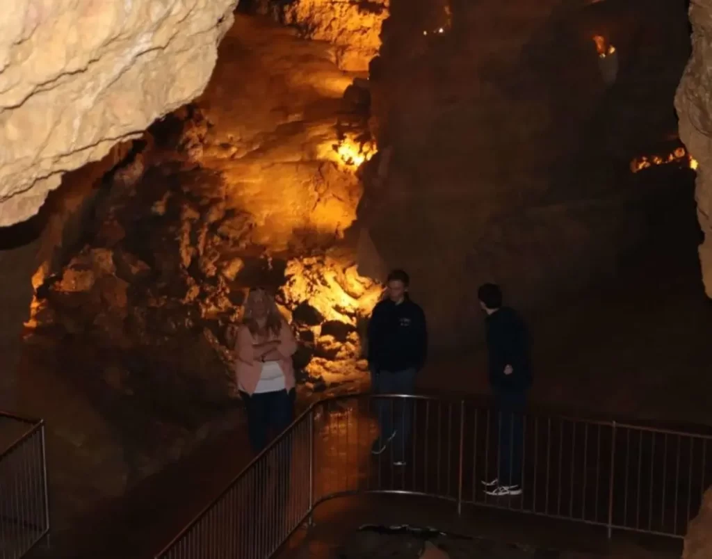 Michelle talking to tour guides in a cave