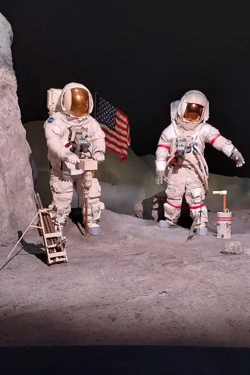 Spacesuits on a moonwalk