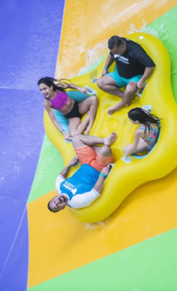 Kalahari Water fun, four people in a inner-tube on a water slide 