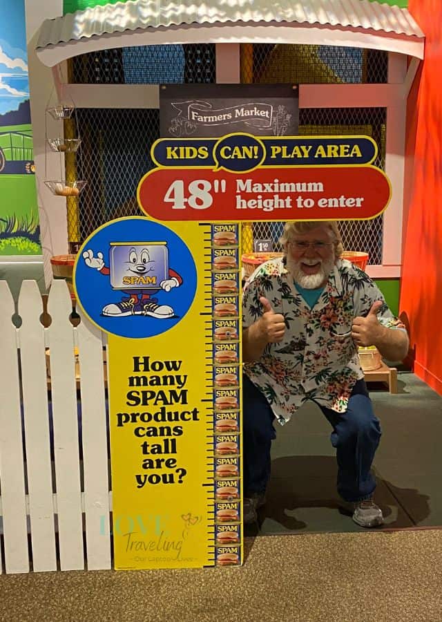 Gary checking his height at the Spam Museum